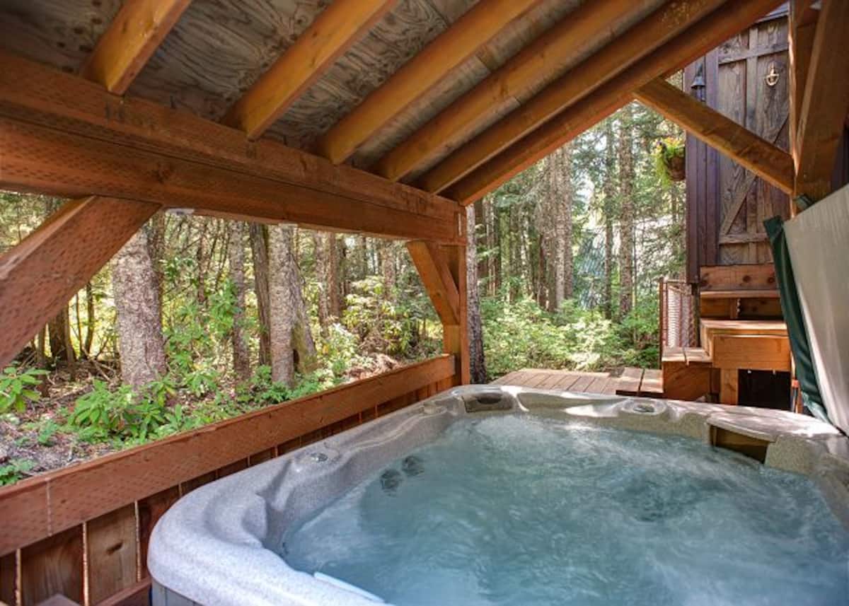 Private covered hot tub looking into the forest