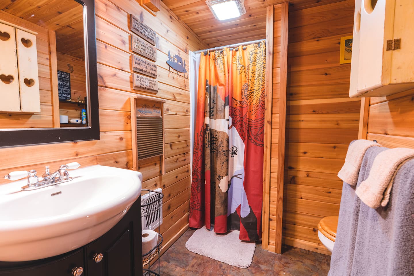 Downstairs bathroom with sink and curtained shower