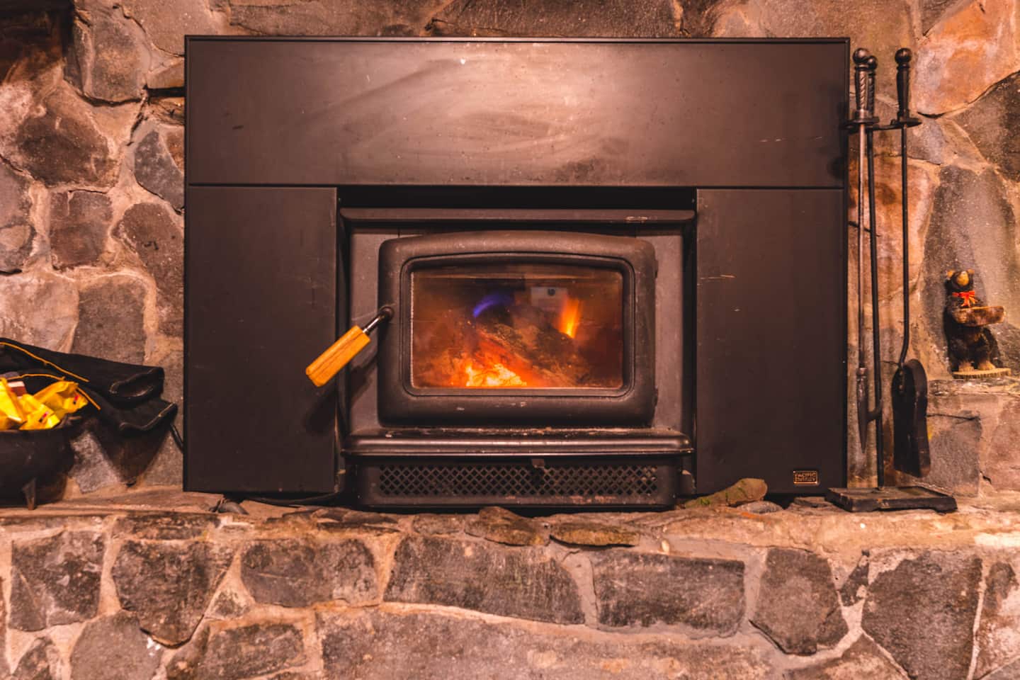 Close view of the glowing wood-burning fireplace